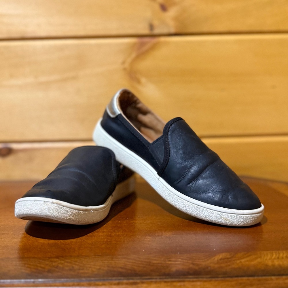 UGG Sammy Black Leather Slip On Sneakers Silver Metallic Heel Tab Womens Shoes